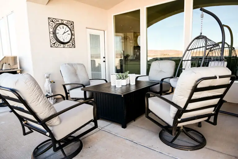 Cozy backyard setup in southern Utah featuring weather-resistant chairs around a modern fire pit for warmth during cool fall evenings.